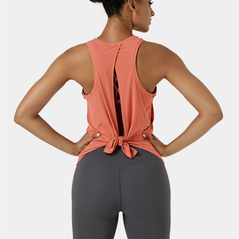 Size 6 Lululemon white tank top with tie in back. Loss fitting.